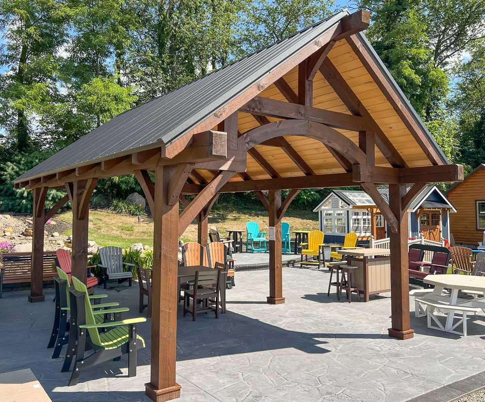 Heavy timber frame pavilion with open gable roof, perfect for backyard entertaining, patio coverage, or public park shelters—built for strength and beauty.